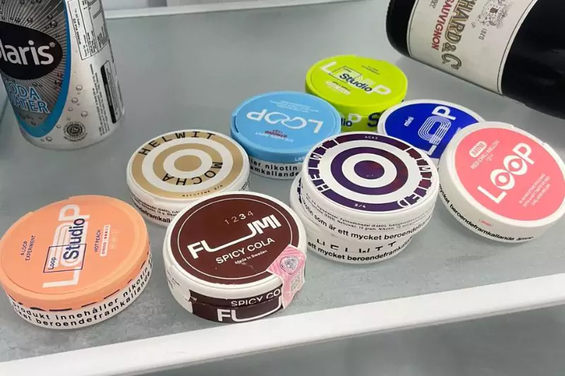 Cans of snus stored in a refrigerator to preserve freshness in Thailand's hot and humid climate.